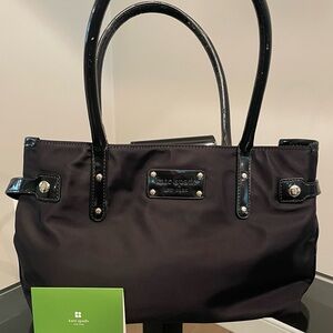 Kate Spade black bag with patent leather throughout and green interior.